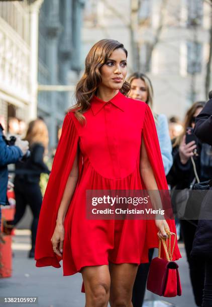 Camila Coelho seen wearing red dress, bag, platform heels outside Valentino during Paris Fashion Week - Womenswear F/W 2022-2023 on March 06, 2022 in...