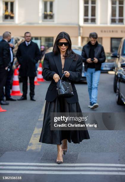 Victoria Barbara seen wearing black blazer tailored, leather skirt, bag, heels outside Valentino during Paris Fashion Week - Womenswear F/W 2022-2023...