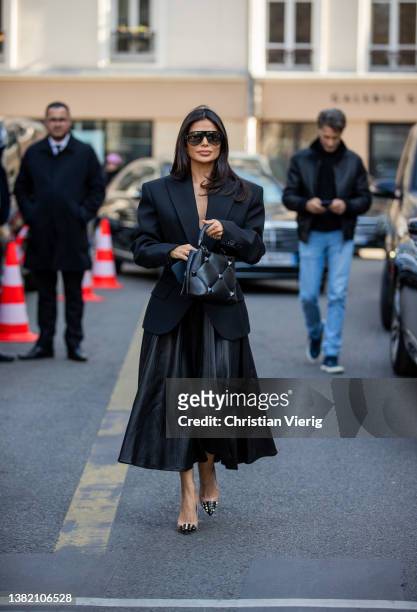 Victoria Barbara seen wearing black blazer tailored, leather skirt, bag, heels outside Valentino during Paris Fashion Week - Womenswear F/W 2022-2023...
