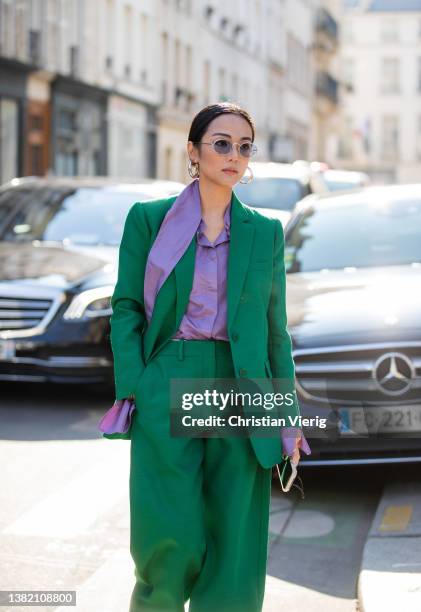 Yoyo Cao seen wearing green suit, wide leg pants, purple silk button shirt outside Valentino during Paris Fashion Week - Womenswear F/W 2022-2023 on...