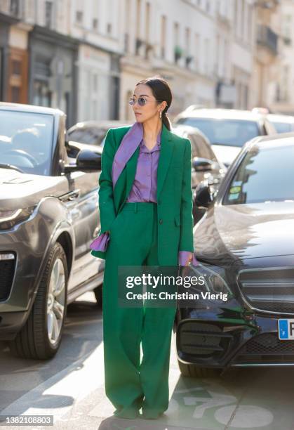 Yoyo Cao seen wearing green suit, wide leg pants, purple silk button shirt outside Valentino during Paris Fashion Week - Womenswear F/W 2022-2023 on...