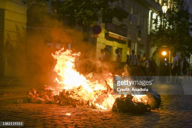 View of a burning garbage as people gather to protest against the death of 17-year-old Nahel, who was shot in the chest by police in Nanterre on June...