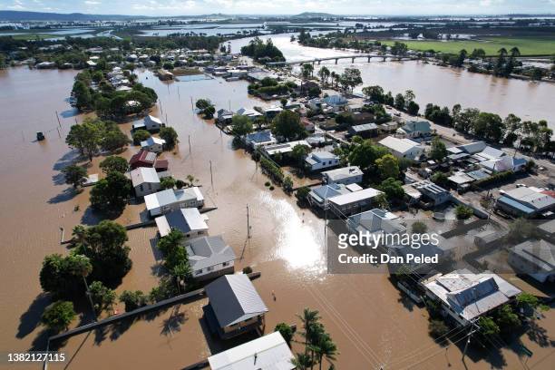 An aerial drone view of houses inundated by floodwater on March 07, 2022 in Woodburn, Australia. Residents of northern New South Wales are still...