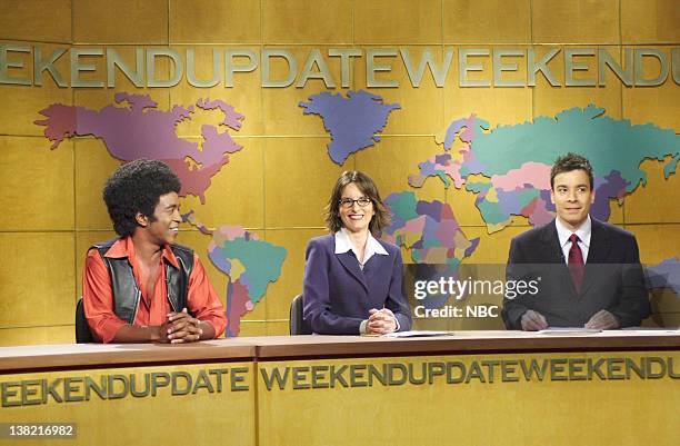 Episode 1 -- Aired -- Pictured: Tim Meadows as Leon Phelps, Tina Fey, Jimmy Fallon during "Weekend Update" on October 10, 2000