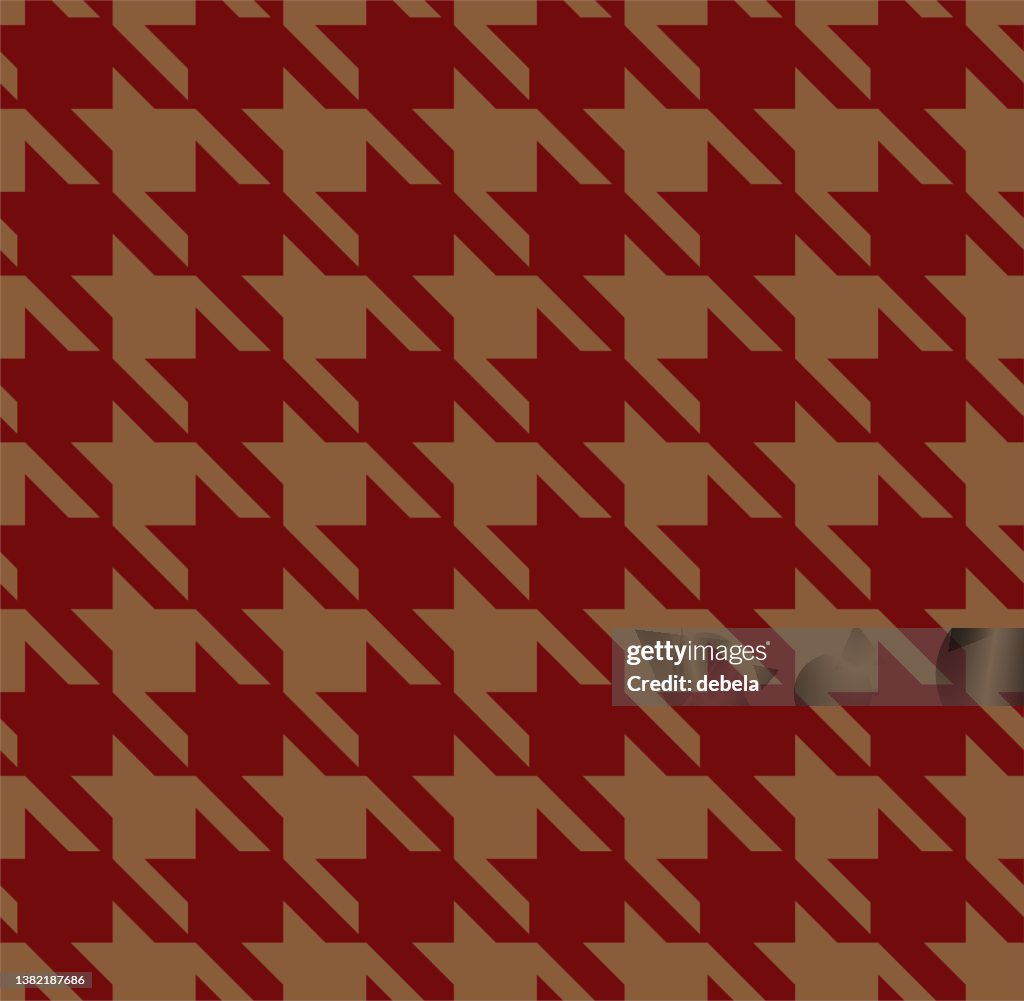 Red and brown houndstooth check pattern close-up.