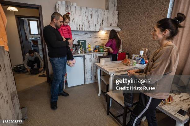 Bessarabian Bulgarians refugee family of Valeri and Alyona Kasa talk in the hotel apartment where they are accommodated on March 5, 2022 in Obzor,...