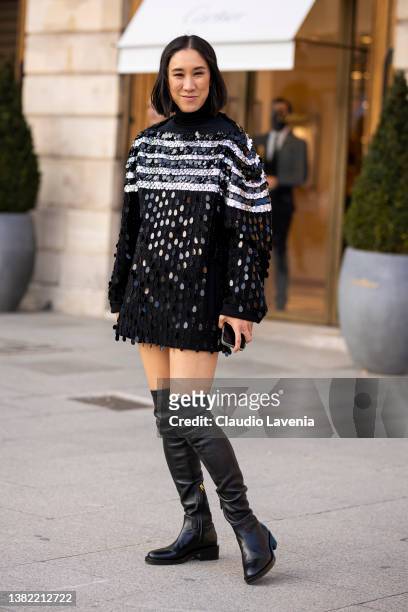 Eva Chen wearing a black and white sequins mini dress with long sleeves and black over the knees boots, is seen outside Schiaparelli, during Paris...