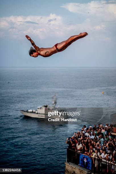 In this handout image provided by Red Bull, Independent athlete Nikita Fedotov dives from the 25.5 metre balcony during the first competition day of...