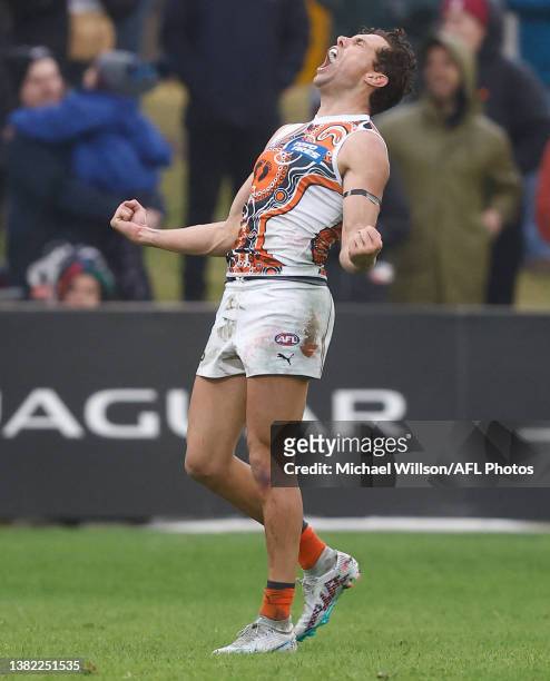 Josh Kelly of the Giants celebrates after kicking the winning goal during the 2023 AFL Round 16 match between the Melbourne Demons and the GWS Giants...