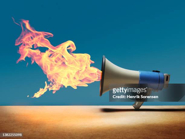 fire out of megaphone - censor stock pictures, royalty-free photos & images