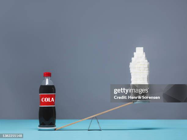 bottle of cola and sugar cubes formed as a bottle - cola bottle stock pictures, royalty-free photos & images