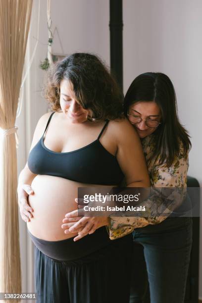 Young pregnant female couple
