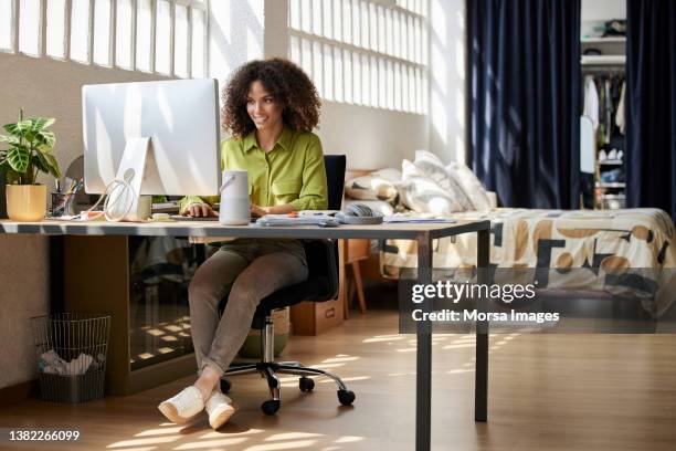 young professional is working at home office - desk with green space view stock pictures, royalty-free photos & images