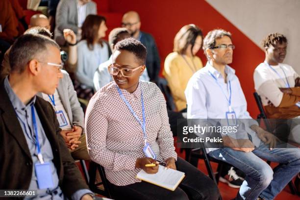 business team at a seminar - international convention center stock pictures, royalty-free photos & images