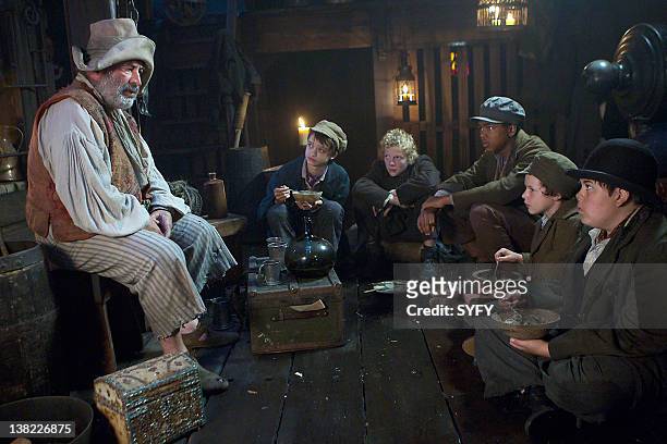 Pictured: Bob Hoskins as Smee, James Ainsworth as Tootles, Patrick Gibson as Curly, Chase Willoughby as Nibs, Thomas Patten as The Twins, Brandon...