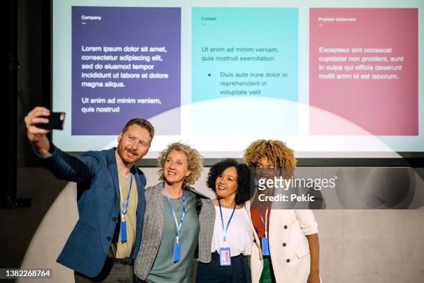 group of conference presenters taking a selfie together - awards ceremony crowd stock pictures, royalty-free photos & images