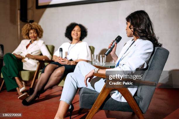 group of businesswoman on panel discussion - press room stock pictures, royalty-free photos & images
