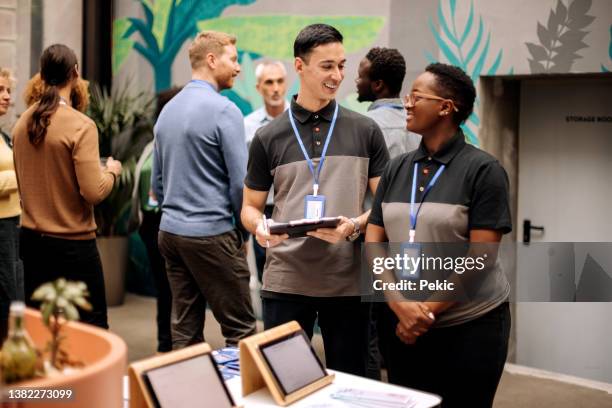 receptionist staff at conference event - uniform stockfoto's en -beelden