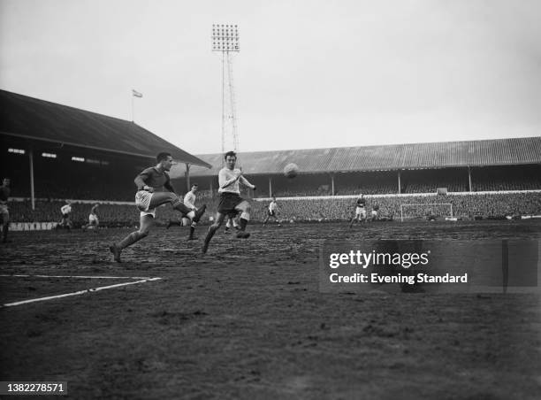 Footballers Jimmy Greaves of Tottenham Hotspur and Ron Harris of Chelsea in a League Divison One match at White Hart Lane in London, UK, 1st February...