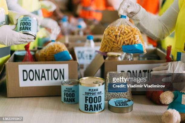 food donation for poor people - food bank stock pictures, royalty-free photos & images