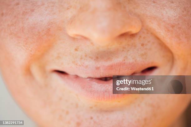 lips of smiling woman with freckles on face - freckle stock pictures, royalty-free photos & images