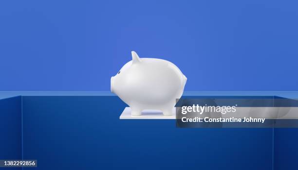 piggy bank on the edge of platform. risk taking concept. - survival concept stock pictures, royalty-free photos & images