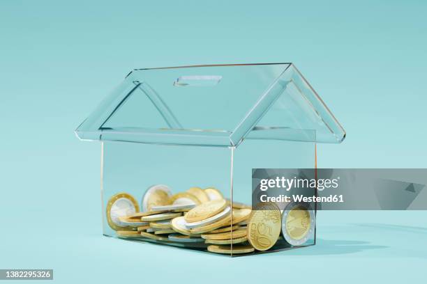 three dimensional render of transparent house shaped coin bank - haus geld stock-grafiken, -clipart, -cartoons und -symbole