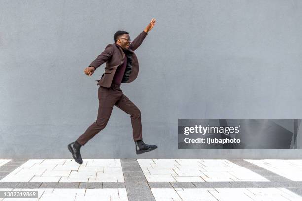 man in a hurry. success here i come. - businessman running stock pictures, royalty-free photos & images