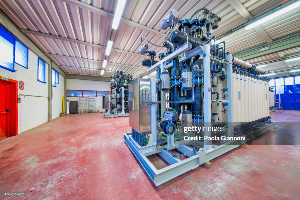 Industry. Sustainability. Water purification filter equipment in plant workshop. Industrial concept.