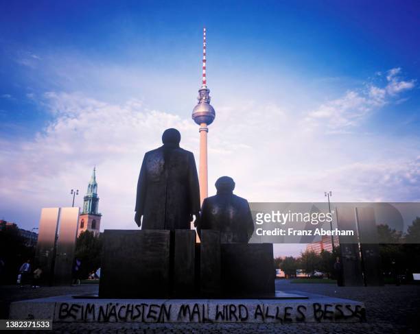 german reunification, east berlin 1990 - friedrich engels stock-fotos und bilder