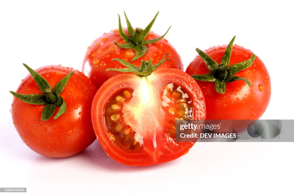 Ripe tomatoes on white background,close up