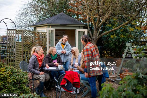 organising their volunteer work - community garden stock pictures, royalty-free photos & images