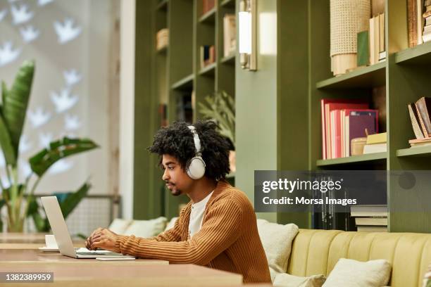 entrepreneur using laptop in creative office - generation z work stock pictures, royalty-free photos & images