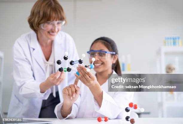School Learning Science Elementary School Student Learning Science With Atom Model High-Res ...