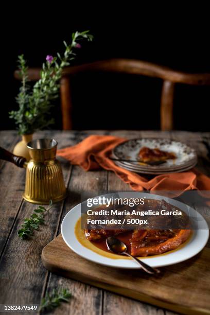 dessert caramel tart,high angle view of food in plate on table,united arab emirates - maria garcia stock pictures, royalty-free photos & images