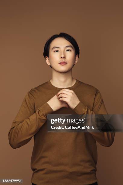 emotional asian man - mens hair model stock pictures, royalty-free photos & images