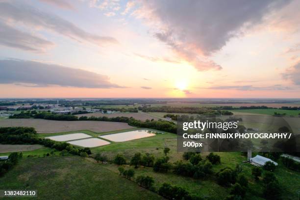 scenic view of landscape against sky during sunset,yoder,kansas,united states,usa - kansas imagens e fotografias de stock