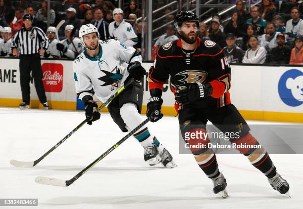 Adam Henrique of the Anaheim Ducks and Scott Reedy of the San Jose Sharks skate during the game at Honda Center on March 6, 2022 in Anaheim,...