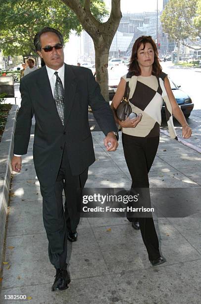 Lisa Bonder Kerkorian leaves the Los Angeles Superior Court with an unidentified person after losing the child support payment dispute with her...