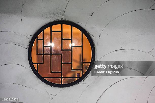 exterior wall w/ a round window - weathered filter stock pictures, royalty-free photos & images