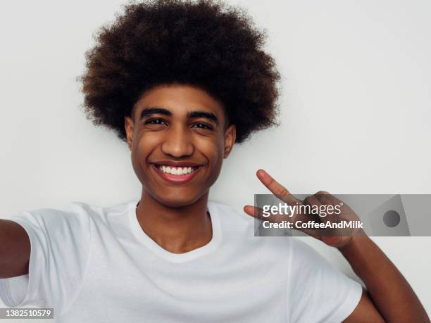 emotional african american man with african hairstyle - mens hair model stock pictures, royalty-free photos & images