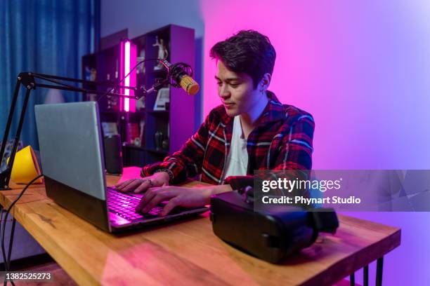 teenage  boy filming videos at home and playing keyboard instrument to camera set on ring light - wfh celebrities stock pictures, royalty-free photos & images