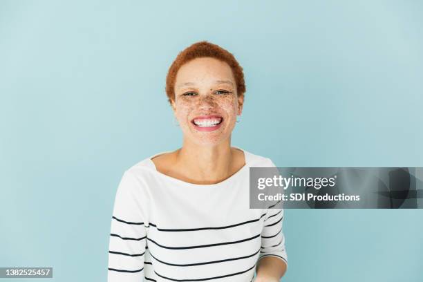 woman in striped shirt - average woman stock pictures, royalty-free photos & images