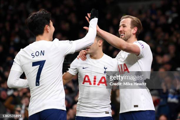 Harry Kane of Tottenham Hotspur celebrates with team mate Heung-Min Son after scoring their sides fifth goal during the Premier League match between...