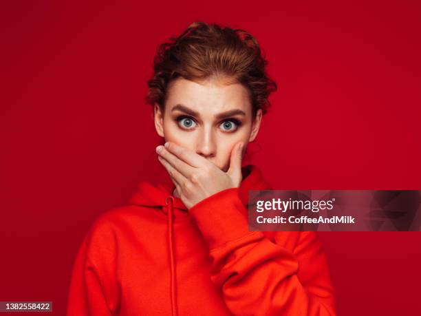 close-up photo of trendy cheerful woman wearing hoodie - red event in bildbanksfoton och bilder