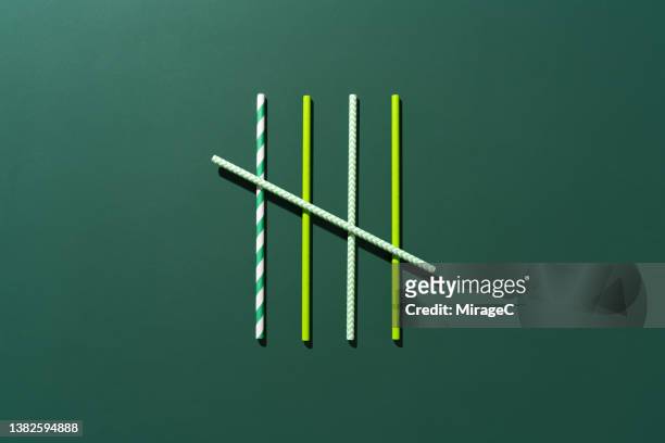 tally chart composed of green drinking straws - fünf stock-fotos und bilder