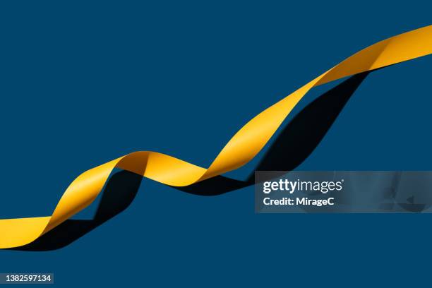 yellow long paper stripe line graph moving up - graph paper bildbanksfoton och bilder