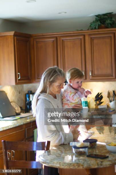 baby in kichen with family - kochen modern stock pictures, royalty-free photos & images