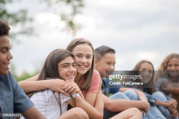 elementary students outside on break - arab student kids stock pictures, royalty-free photos & images