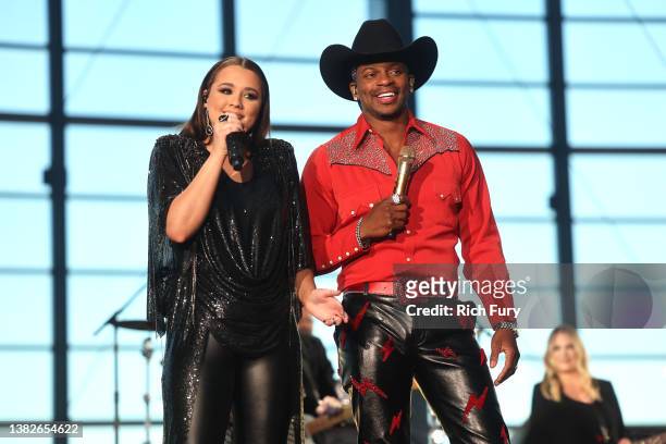 Hosts Gabby Barrett and Jimmie Allen speak onstage during the 57th Academy of Country Music Awards at Allegiant Stadium on March 07, 2022 in Las...